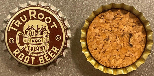 Vintage Tru Root Root Beer bottle cap showing cork lining, front and back views on gray surface, with brown and cream