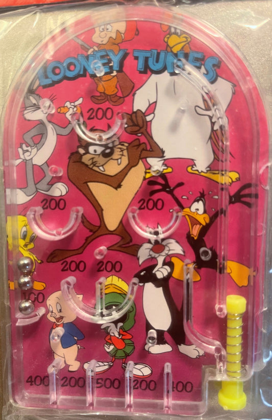 Pink pinball game featuring Looney Tunes characters with "200" and "400" point values visible on the playfield and yellow plu