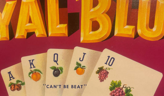 Vintage fruit crate label showing playing cards with fruit illustrations and "CAN'T BE BEAT" text on burgundy background