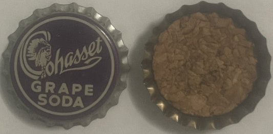 Front and back of vintage Cohasset Grape Soda bottle cap with Native American head logo and cork lining, displayed on white s