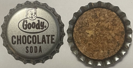 Front and back views of a metal bottle cap embossed "Goody Chocolate Soda" with skull logo, showing silvered front and cork-l