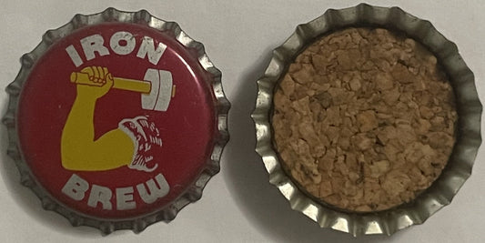 Front and back of vintage Iron Brew bottle cap with red enamel face showing yellow strongman flexing bicep holding barbell, c