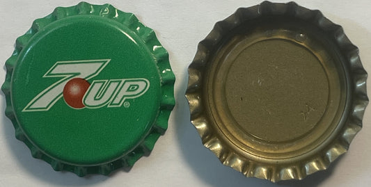 Two vintage 7-Up bottle caps shown front and back: green cap with red dot logo and white text, brass-colored underside