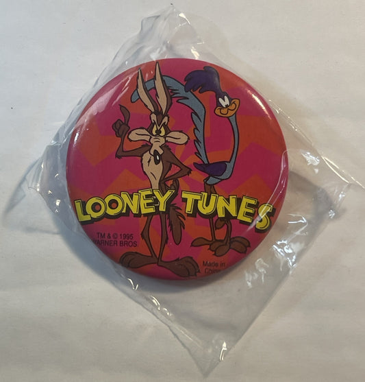 Round red pin in clear plastic bag featuring Bugs Bunny and Road Runner with "LOONEY TUNES" text, 1995 Warner Bros copyright