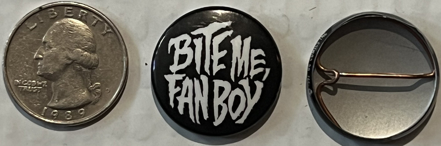 Three views of a vintage pinback button shown next to a quarter for scale: obverse with "LIBERTY" text, reverse with "BITE ME