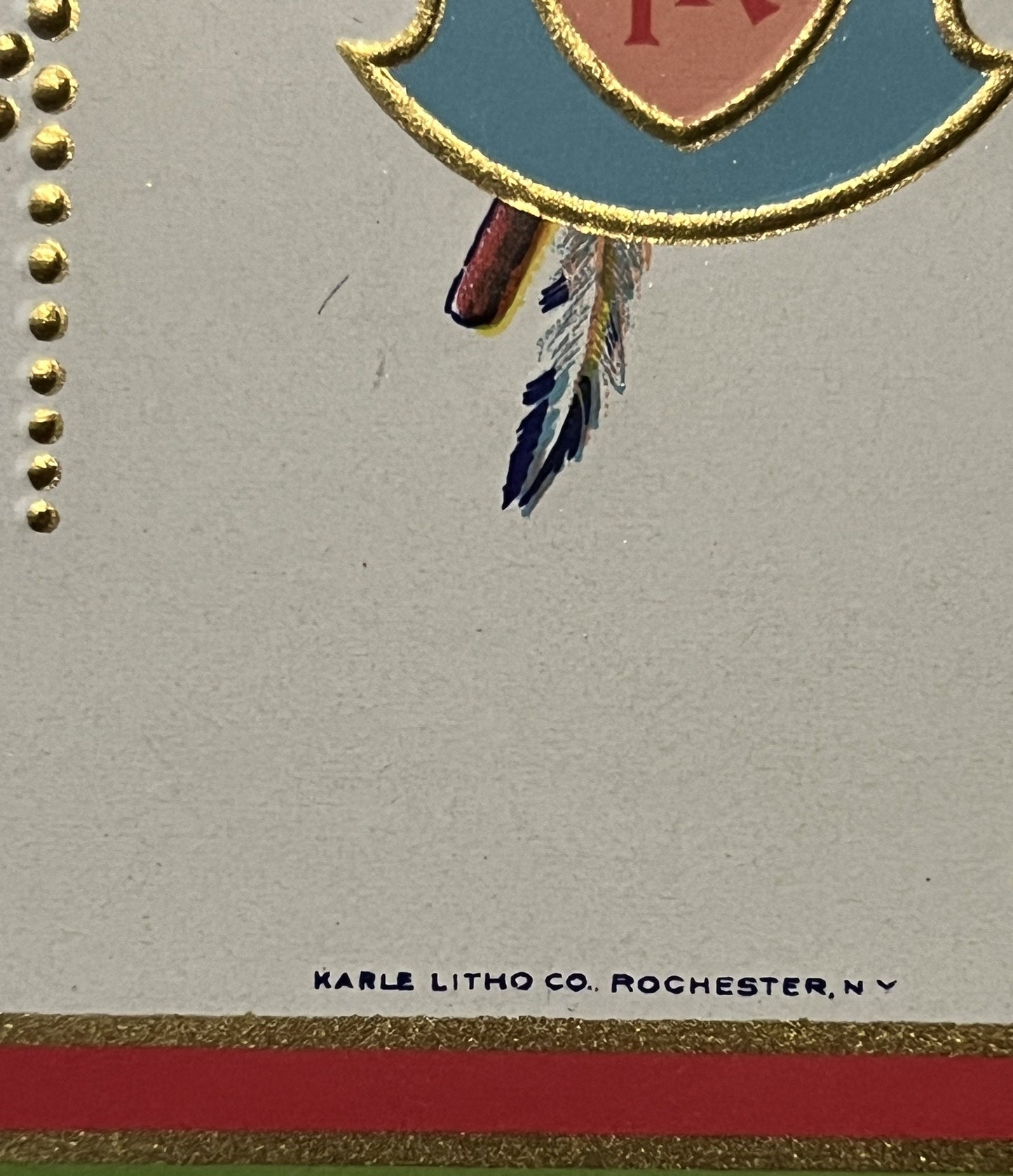 Gold-embossed label detail showing Native American chief profile with feathered headdress and "Karle Litho Co. Rochester NY"