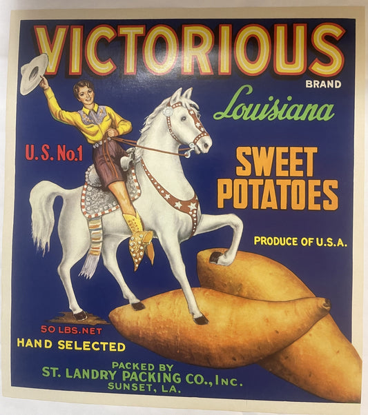 Vintage Victorious Brand sweet potato crate label featuring a cowgirl on a white horse holding a hat, with large golden potat