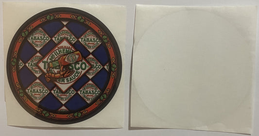 Circular vintage Tabasco sauce sticker with red border, blue diamond pattern, and repeated brand logos on cream-colored backi