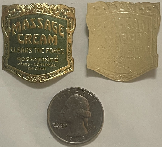 Antique massage cream label with ornate gold border, green enamel center, and reverse side shown next to quarter for scale