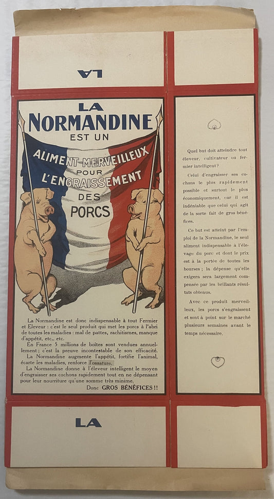 Vintage French La Normandine pig feed box with red borders, French flag imagery, and two pigs illustrated on cream-colored ca