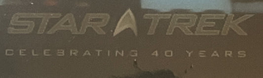Close-up of Star Trek logo and "Celebrating 40 Years" text embossed on sealed poster packaging