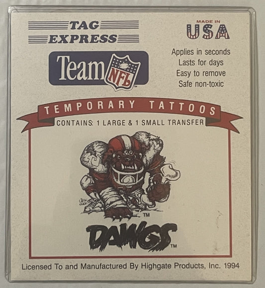 Package of vintage Cleveland Browns Dawg Pound temporary tattoos from 1994, showing cartoon mascot with red and white colorin
