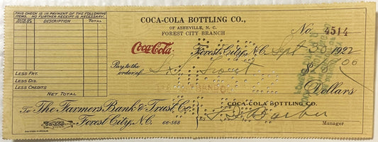 Vintage Coca-Cola Bottling Co. bank check No. 4514 from Forest City Branch, Asheville NC, dated 1921-1922, with handwritten e