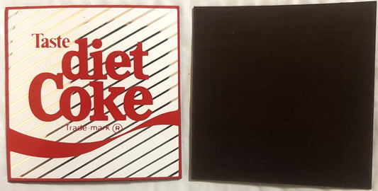 Vintage Diet Coke refrigerator magnet with red and white striped design and black back, displayed flat against white surface.