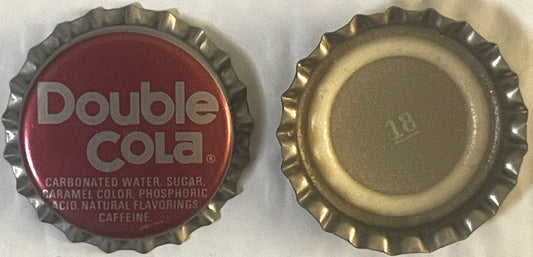 Vintage Double Cola bottle cap shown front and back; red side displays brand name and ingredients, reverse shows plain metall