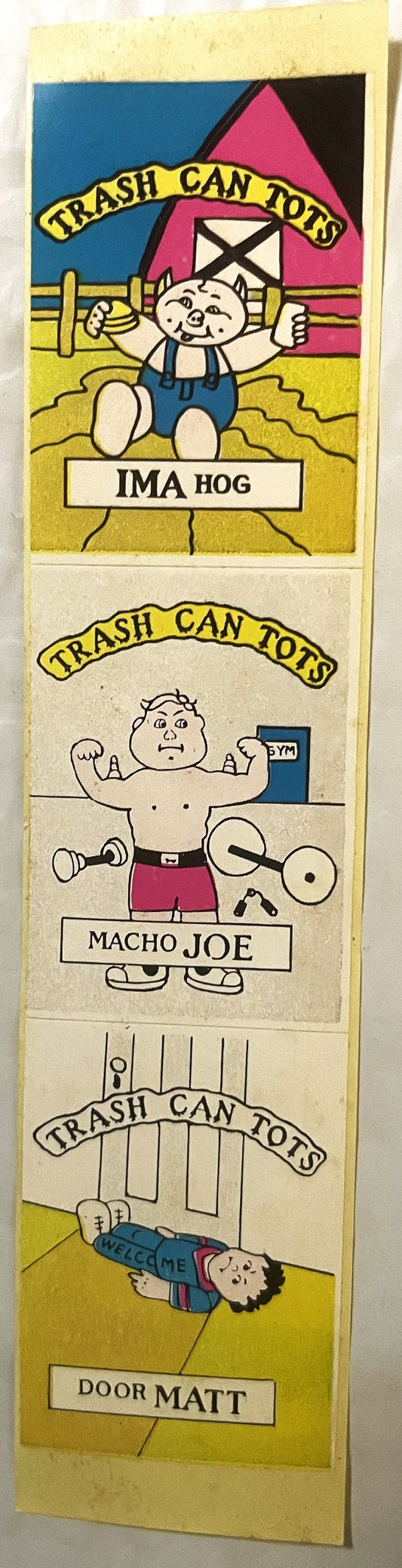 Vertical strip of four colorful 1980s sticker cards titled "Trash Can Tots" featuring cartoon characters Ima Hog, Macho Joe,