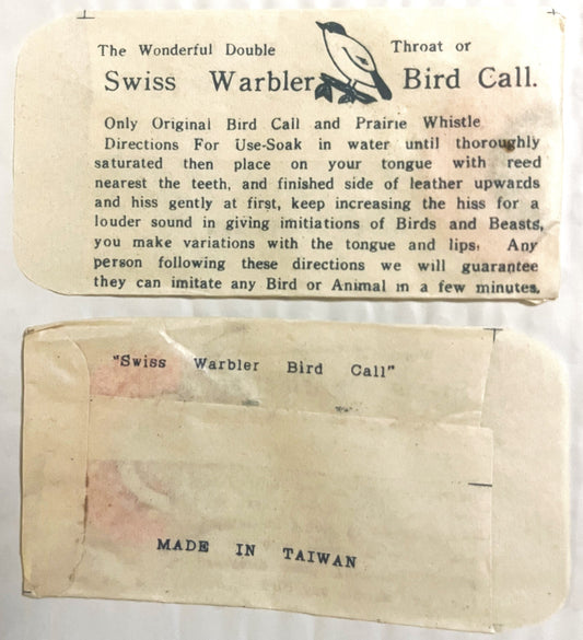 Vintage Swiss Warbler bird call packaging showing instruction card and envelope labeled "Made in Taiwan," cream-colored paper