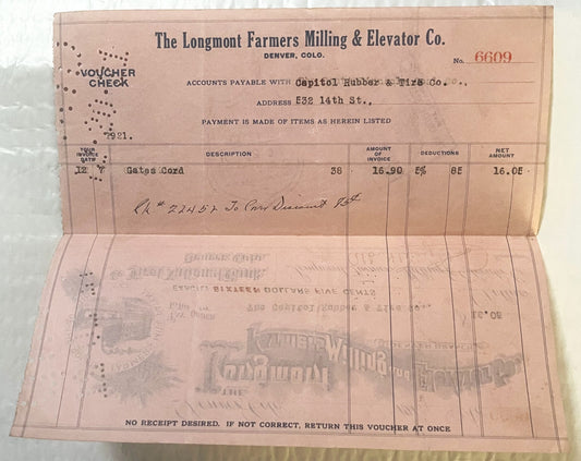 Vintage 1921 pink voucher check from Longmont Farmers Milling & Elevator Co., Denver, with printed fields for description, am