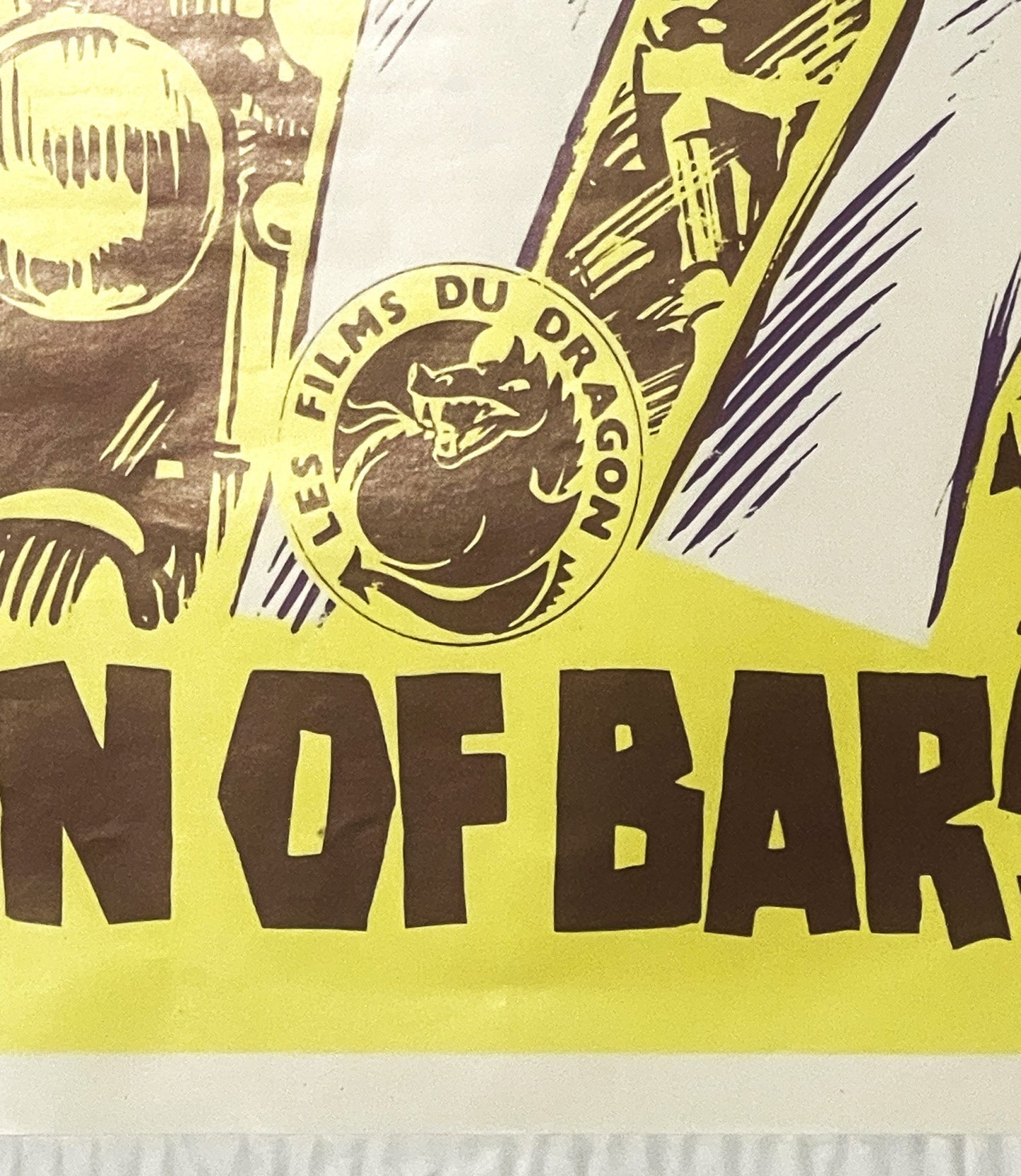 Close-up of vintage movie poster showing yellow and brown colors with "NOFBAR" text visible and circular "Les Films du Orago"