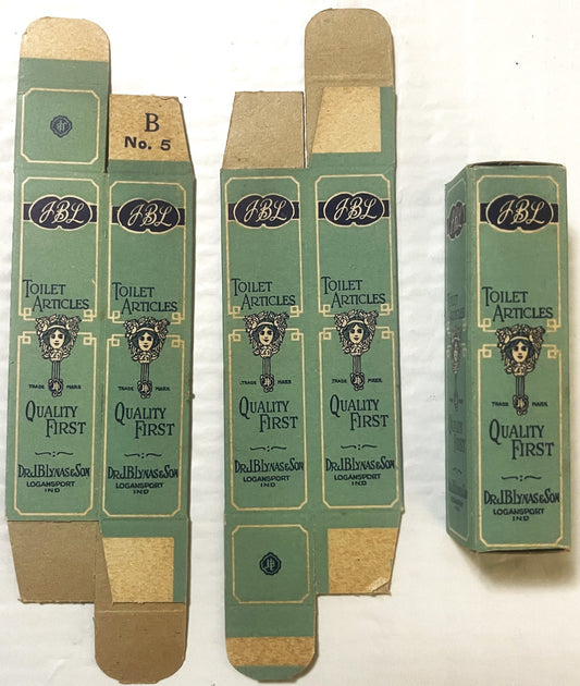 Unfolded vintage JBL green and tan toilet articles boxes by Dr. J.B. Lynas & Son, Logansport Indiana, showing decorative woma