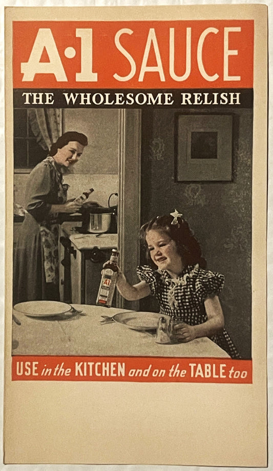 Vintage A-1 Sauce pamphlet cover with orange and black design showing two women in a 1940s kitchen, one cooking and one at ta