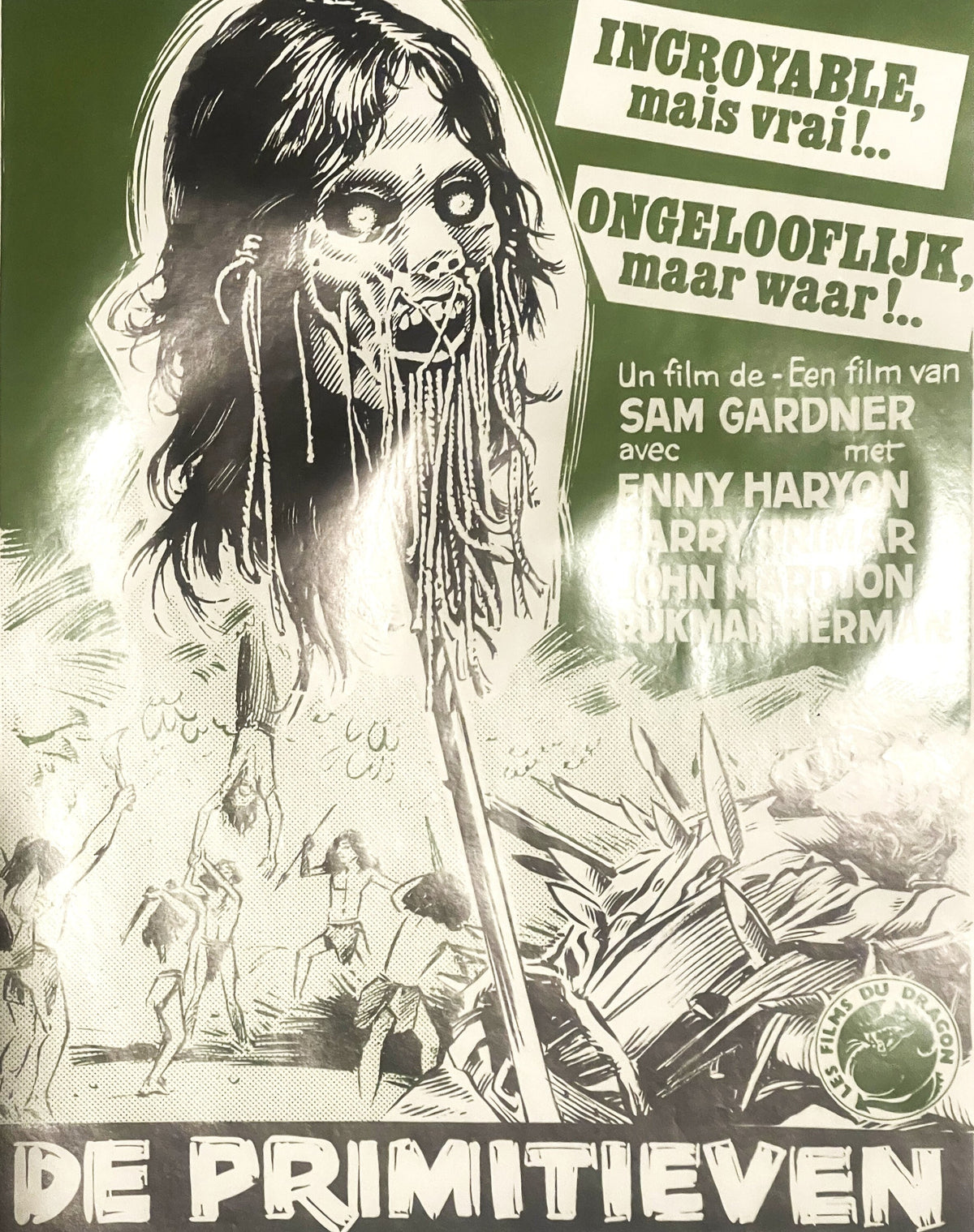 Vintage Belgian movie poster featuring a grotesque monster face with wild hair against green background, with "De Primitieven