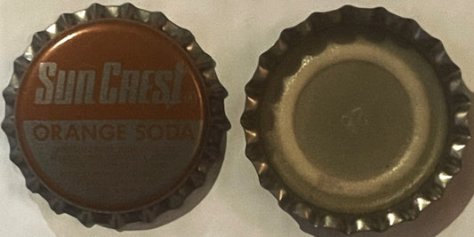 Vintage Sun Crest Orange Soda bottle cap shown front and back, with corrugated metal edges and embossed text on brown interio