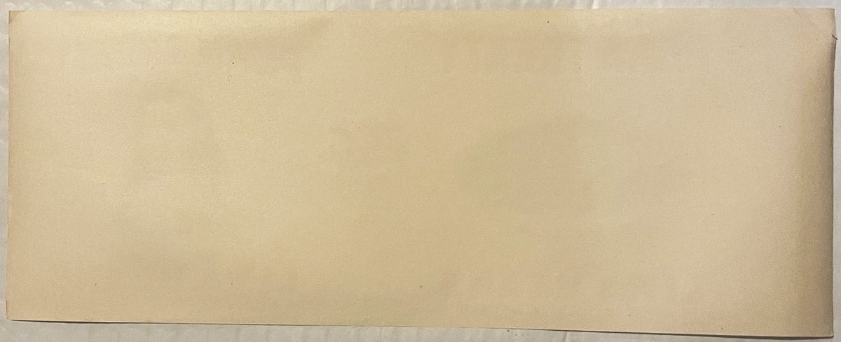 Blank cream-colored vintage can label with no visible printed text or imagery