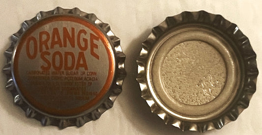 Front and back views of an orange soda bottle cap with embossed metal ridges and red printed text on cream-colored background