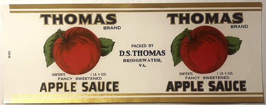 Vintage Thomas Brand apple sauce label featuring two identical red apples with green leaves and gold text on cream background