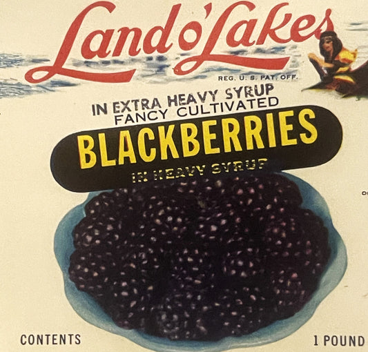 Vintage Land o' Lakes blackberries can label featuring red script logo, blue bowl of dark berries, yellow text, and Native Am