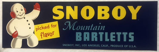 Vintage Snoboy fruit crate label featuring a smiling snowman with red mittens and text reading "Mountain Bartletts" on dark b