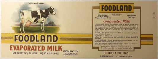 Vintage Foodland evaporated milk label featuring black and white cow, yellow and gold borders, red text, Cleveland Ohio distr