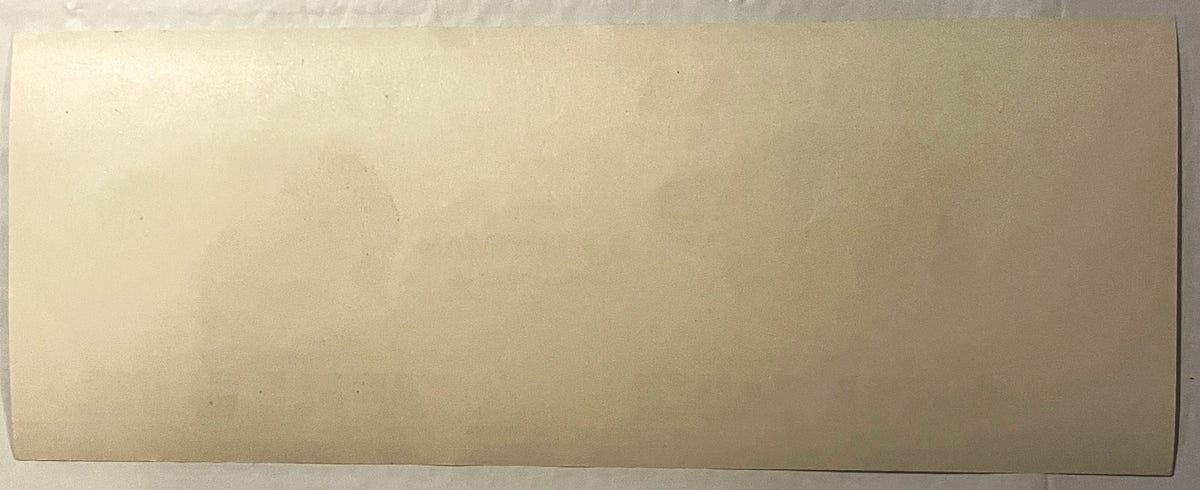 Antique Thomas Apple Sauce can label, cream-colored paper with faded printed text, flat lay view showing front label design, approximately 11x4 inches.
