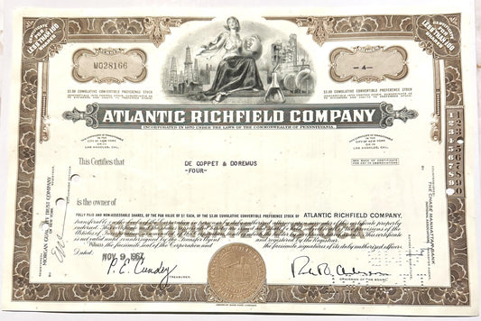 Vintage 1960s Atlantic Richfield Company stock certificate with ornate brown border, central allegorical engraving, and signa