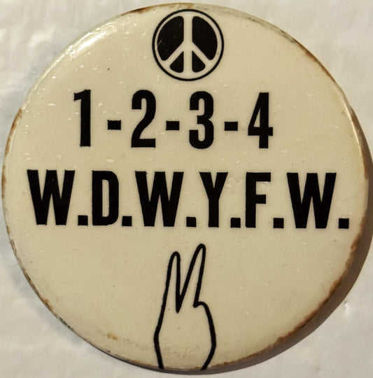 Cream-colored vintage protest button pin with peace symbol at top, "1-2-3-4 W.D.W.Y.F.W." text, and peace hand gesture at bot