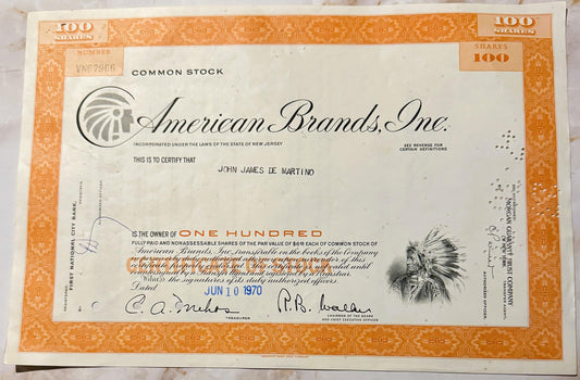 Vintage American Brands Inc stock certificate for 100 shares, featuring Native American chief vignette and orange decora