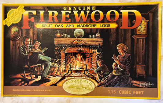 Vintage firewood crate label featuring a cozy fireplace scene with a family, gold lettering, and Bloomfield Farms branding fr