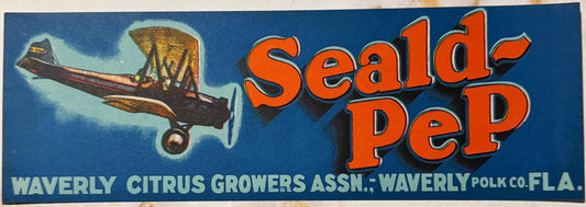 Vintage Seald-PeP citrus crate label featuring orange text and a biplane illustration on blue background with Waverly growers