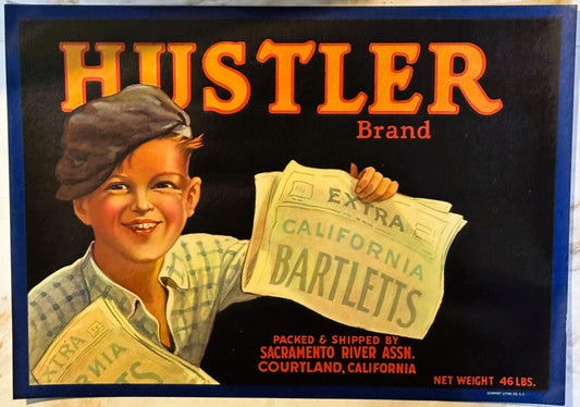 Vintage Hustler Brand fruit crate label featuring a smiling newsboy holding California Bartletts newspaper, packed by Sacrame