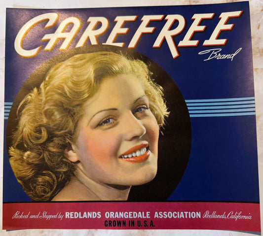 Vintage citrus crate label featuring a blonde woman's portrait in profile against a dark blue background, with "Carefree Bran