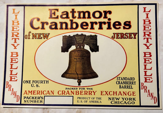 Vintage cranberry barrel label featuring Liberty Bell illustration, yellow background with red and orange text, "Eatmor Cranb