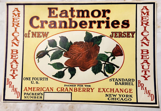 Vintage cranberry barrel label featuring red rose illustration, yellow background, "Eatmor Cranberries of New Jersey" text, A