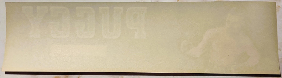 Cream-colored vintage crate label with faint "PUGGY" text visible at top and dark stripe along bottom edge, unfilled stock im