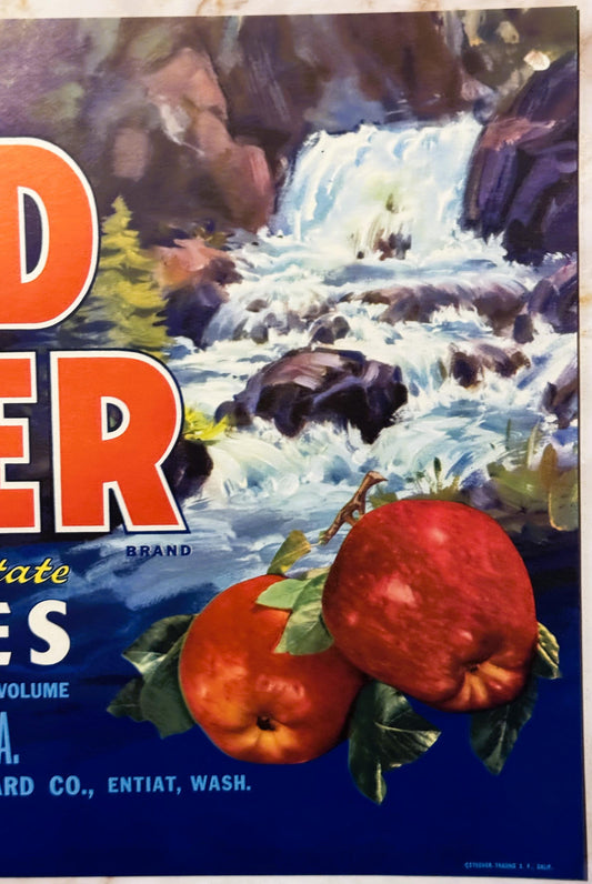 Vintage Mad River Brand apple crate label featuring two red apples with leaves against a waterfall landscape and orange text