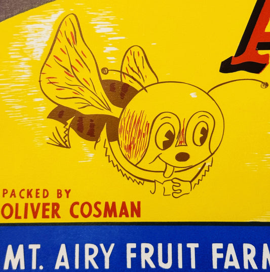 Vintage bee crate label with smiling cartoon bee character, yellow background, red and brown accents