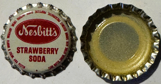 Front and back of Nesbitt's Strawberry Soda bottle cap showing red text on cream background and corrugated metal interior