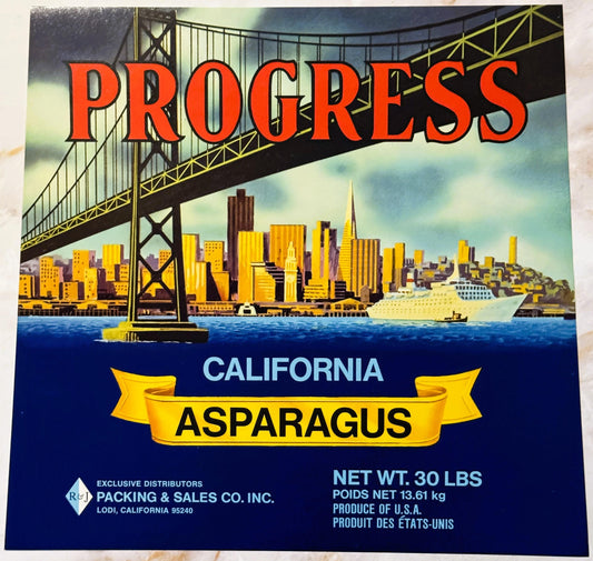 Vintage Progress brand California asparagus crate label featuring San Francisco skyline and Golden Gate Bridge in yellow and
