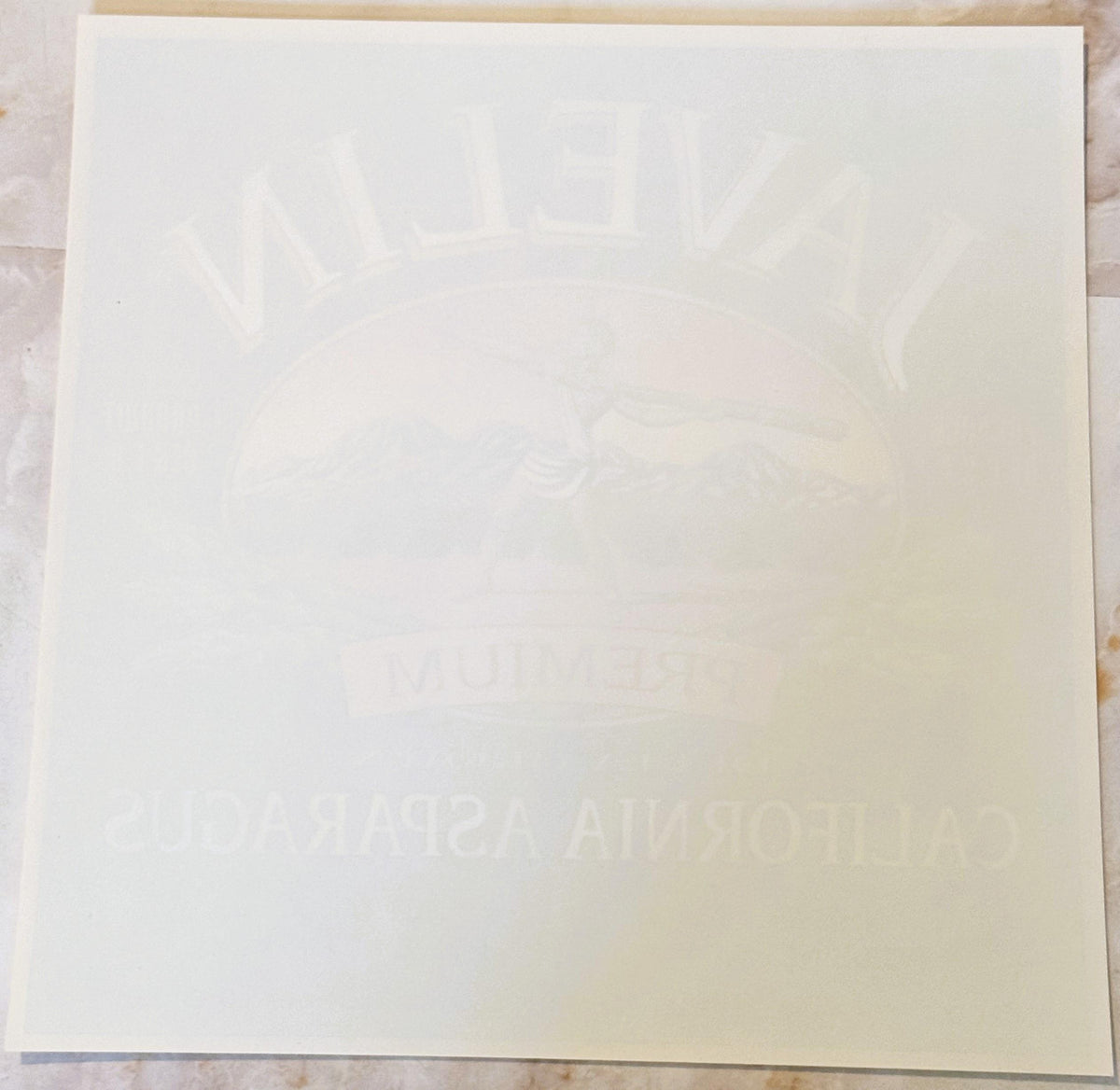 Back of the Javelin label: plain paper with the JAVELIN, PREMIUM and California Asparagus lettering showing faintly through in reverse