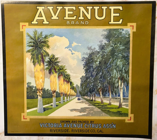 Vintage citrus crate label with gold border featuring a tree-lined avenue, palm trees, and a car; text reads "Avenue Brand" a